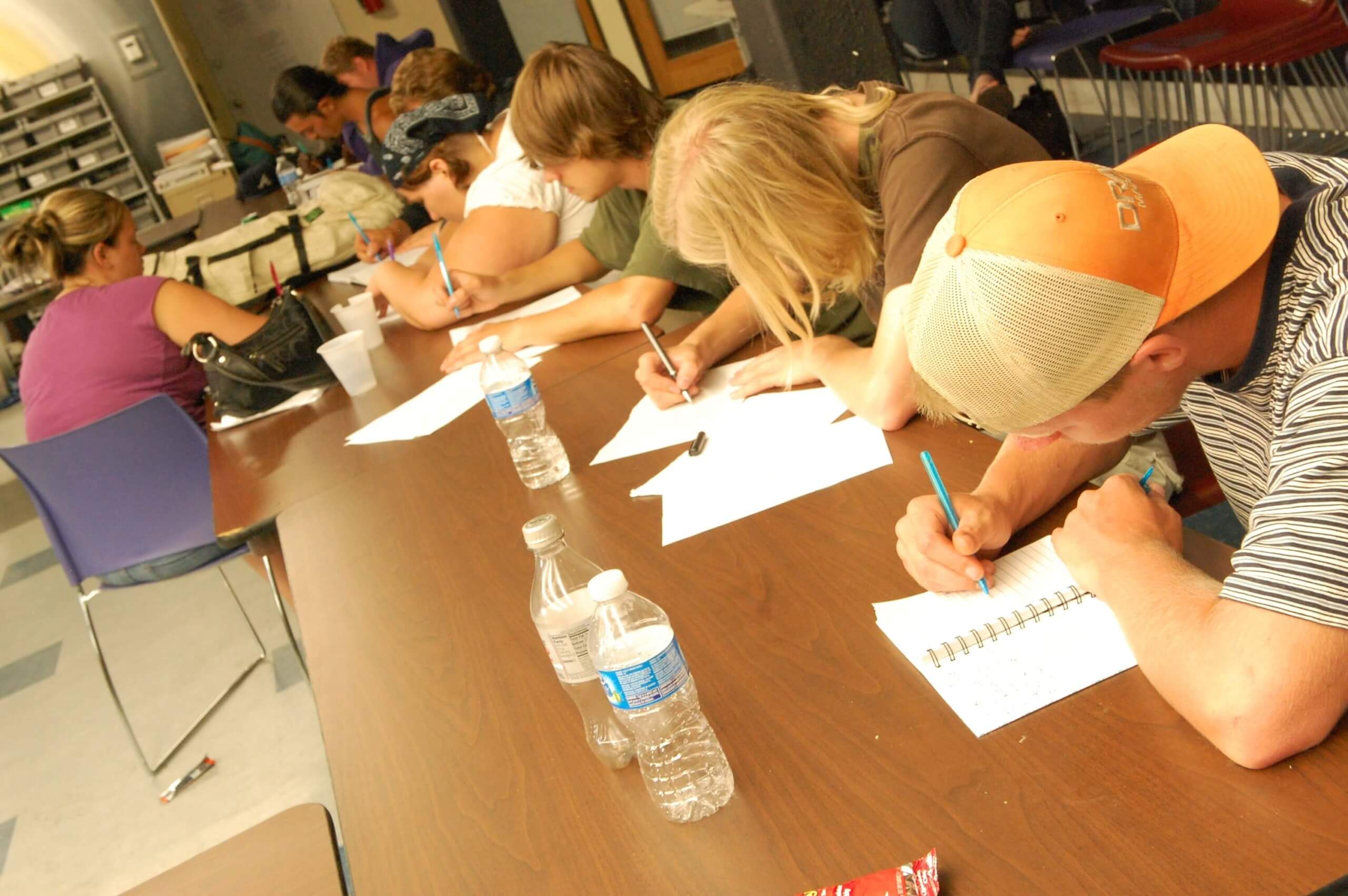 Group of youth writing