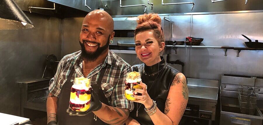 Laura and Chef Brian holding up their blueberry trifles